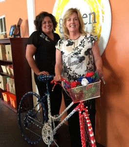 Mary Carabella and Suzanne Thompson of the MS Society with a bike being raffled as part of the event