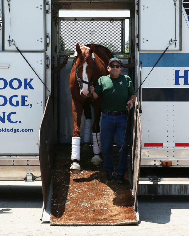 Assistant trainer Jimmy Barnes led Kenucky Derby (GI) winner and Triple Crown hopeful Justify off the van at Churchill Downs following the colt's return from his Preakness (GI) victory at Pimlico. (Coady Photography/Churchill Downs)